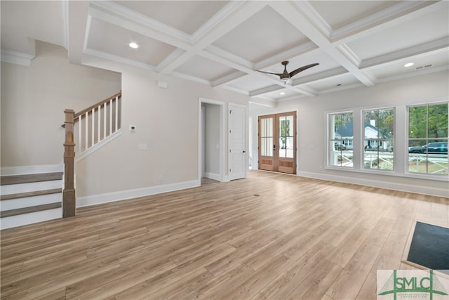 unfurnished living room featuring beam ceiling, ceiling fan, french doors, coffered ceiling, and light hardwood / wood-style flooring