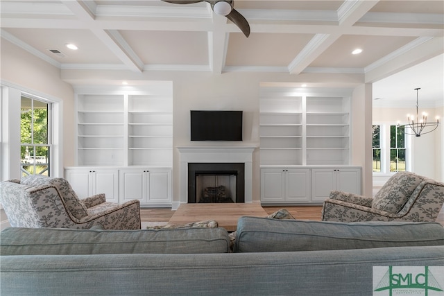 living room with beamed ceiling, ornamental molding, and coffered ceiling