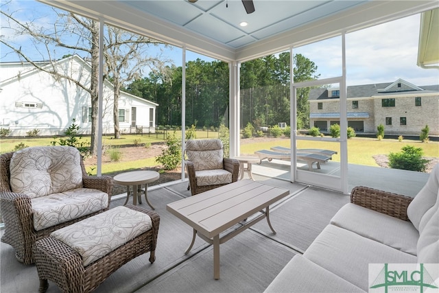 sunroom featuring ceiling fan