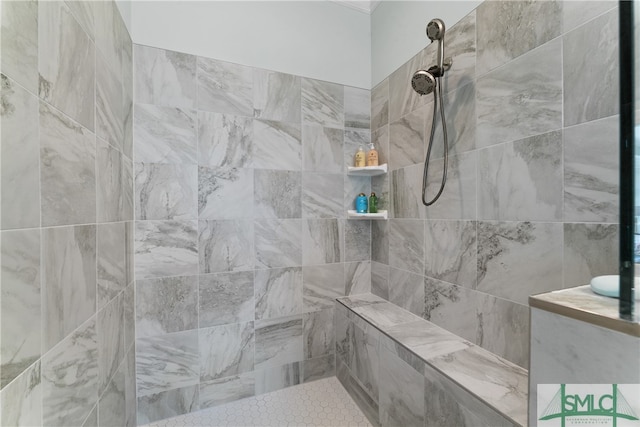 bathroom with a tile shower