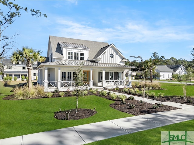 view of front of home featuring a front yard and a porch