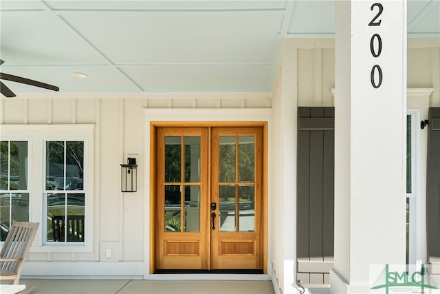 view of exterior entry featuring french doors and ceiling fan