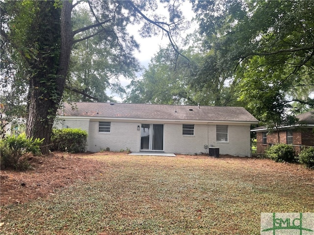 back of property with central AC unit