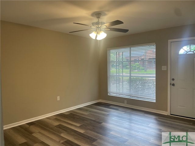 entryway with dark wood-type flooring and ceiling fan