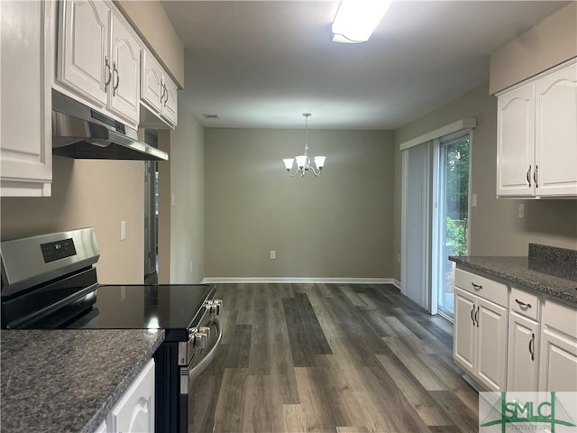 1340 E Henry St, Savannah, GA 31404 - kitchen with white cabinets, under cabinet range hood, an inviting chandelier, stainless steel range with electric stovetop, and dark wood-style flooring