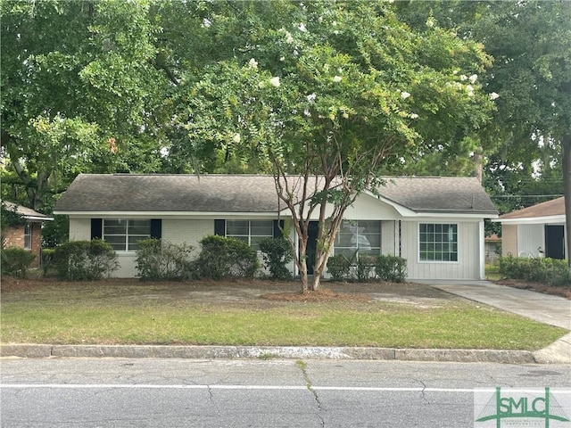 1340 E Henry St, Savannah, GA 31404 - ranch-style home featuring brick siding, a front yard, and concrete driveway