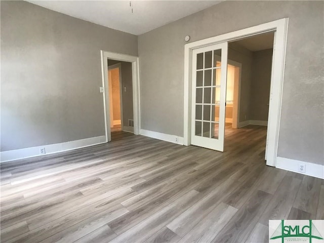 empty room featuring hardwood / wood-style flooring