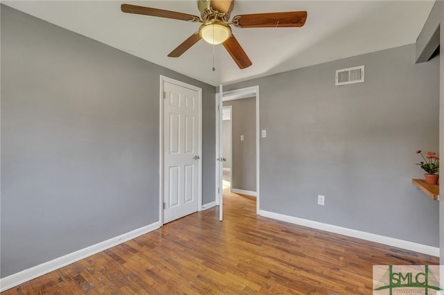 empty room featuring ceiling fan and light hardwood / wood-style flooring