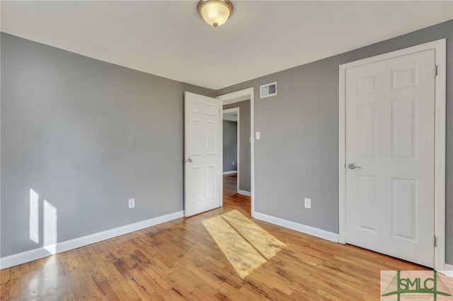 unfurnished bedroom with light wood-type flooring