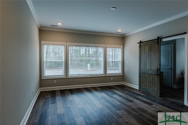 unfurnished bedroom featuring crown molding, dark hardwood / wood-style floors, multiple windows, and a barn door