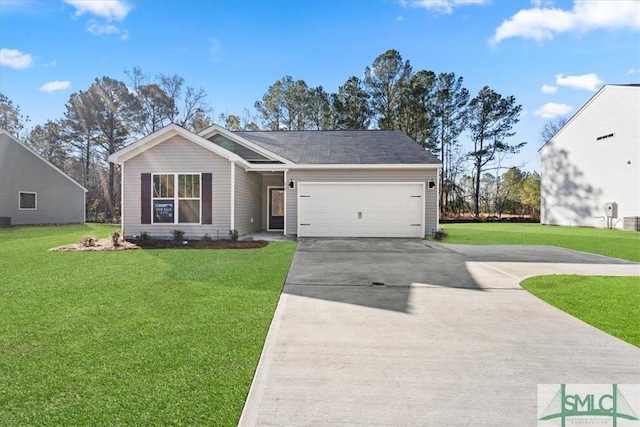 view of front facade with a front yard and a garage