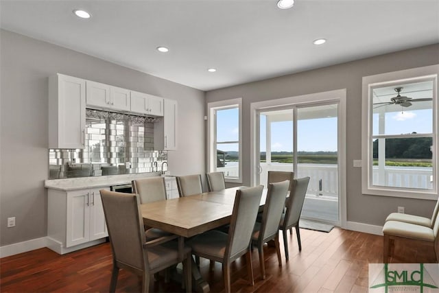 dining area featuring dark wood-style flooring, recessed lighting, and baseboards