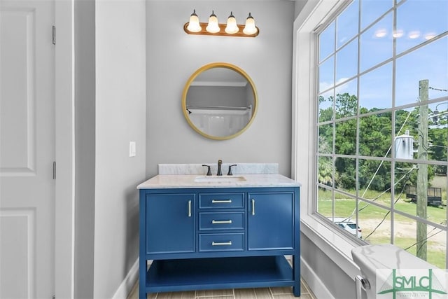 bathroom featuring vanity and baseboards