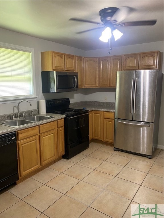 kitchen featuring ceiling fan, black appliances, sink, and light tile patterned floors