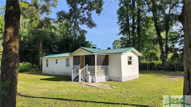 view of outbuilding featuring a lawn