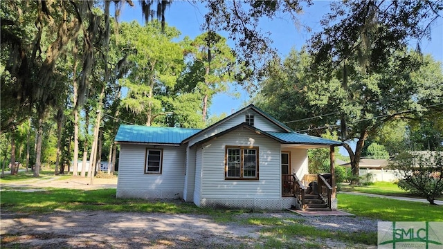 back of house with a yard