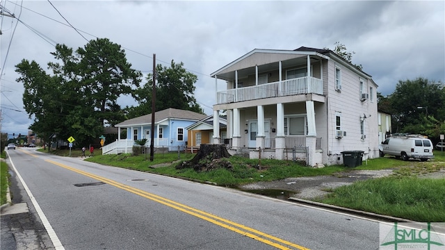 view of front of home featuring a balcony