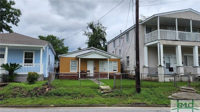 view of front of property with a porch and a balcony