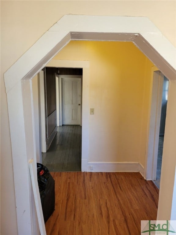 bonus room with dark hardwood / wood-style floors