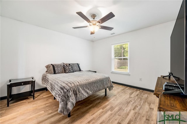 bedroom featuring light hardwood / wood-style flooring and ceiling fan