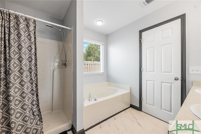 bathroom featuring vanity and shower with separate bathtub