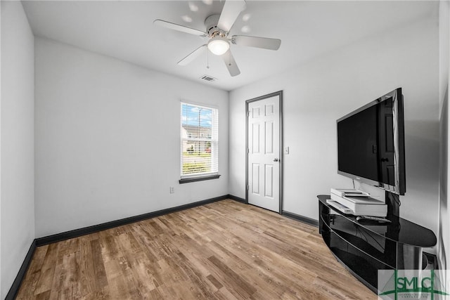 interior space featuring light hardwood / wood-style floors and ceiling fan