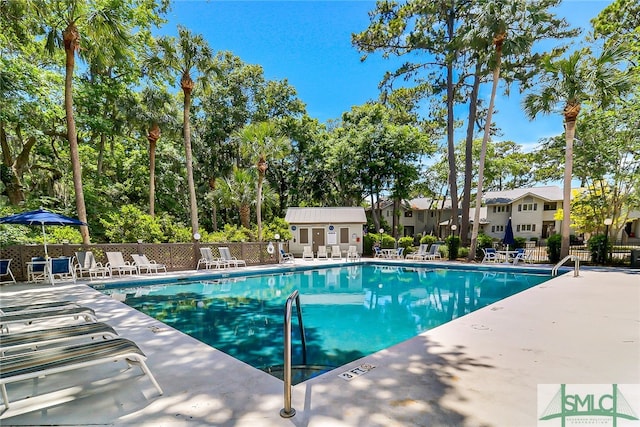 view of swimming pool with a patio