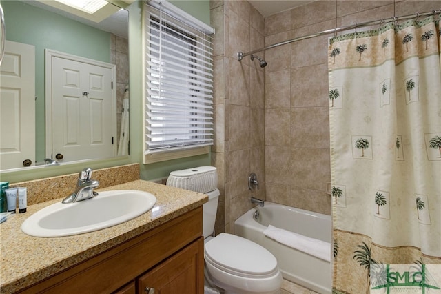 full bathroom with shower / bath combo, vanity, and toilet