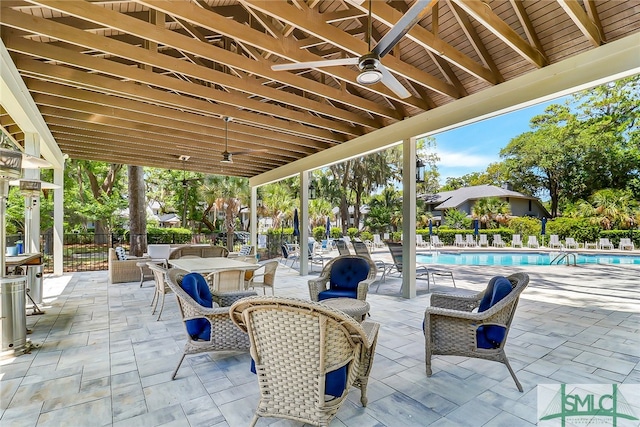 view of patio / terrace featuring a community pool and ceiling fan