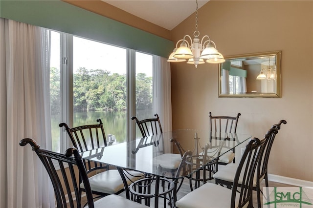 dining space with a chandelier and lofted ceiling