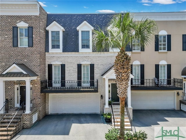 view of front of house with a balcony and a garage