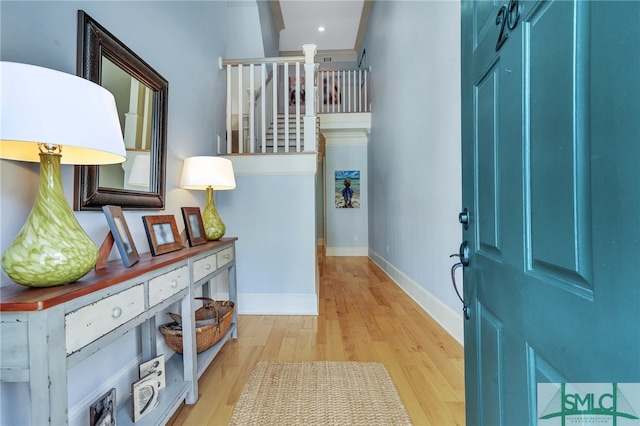 foyer entrance with light hardwood / wood-style floors