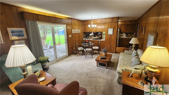 living room with wood walls, a healthy amount of sunlight, and carpet