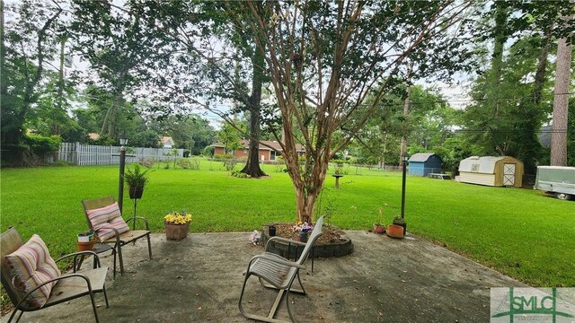 view of patio / terrace with a storage shed