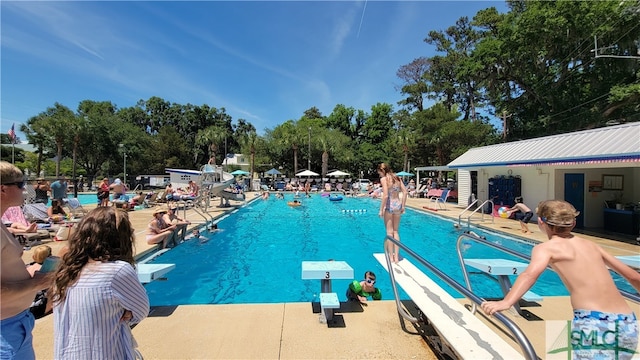 view of swimming pool featuring a patio area