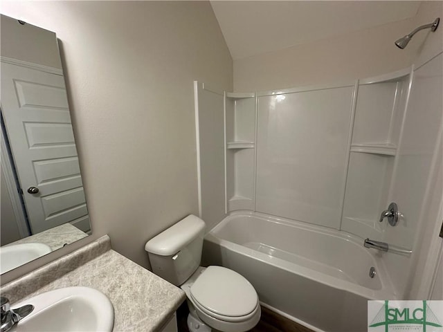 full bathroom with vanity, toilet, shower / bath combination, and vaulted ceiling