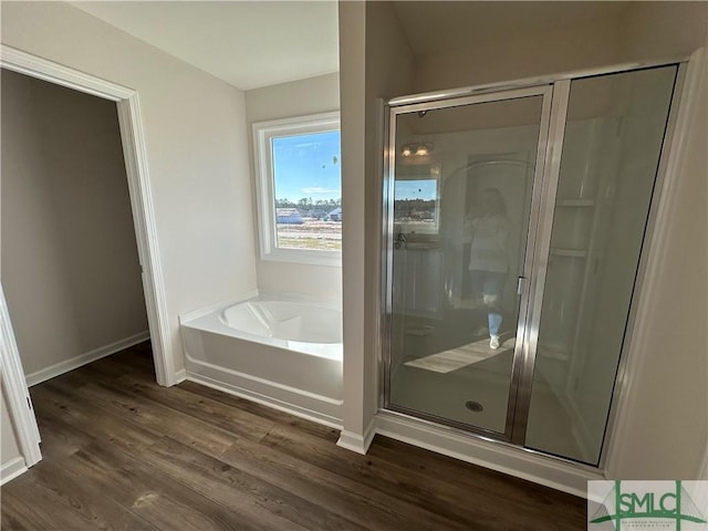 bathroom with separate shower and tub and hardwood / wood-style flooring