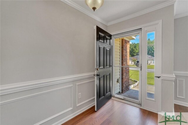 doorway to outside with crown molding and dark hardwood / wood-style floors