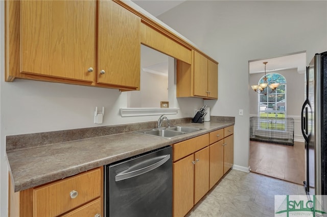 kitchen featuring crown molding, appliances with stainless steel finishes, a notable chandelier, sink, and light hardwood / wood-style floors