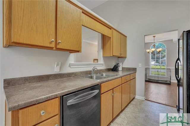 kitchen featuring sink, stainless steel fridge, a chandelier, and dishwasher