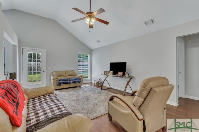 living room with ceiling fan, high vaulted ceiling, and hardwood / wood-style flooring