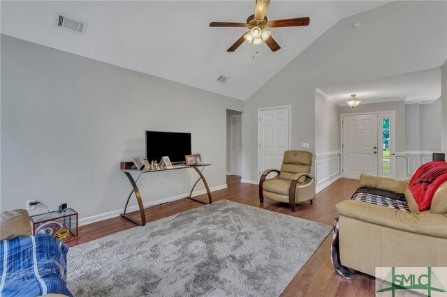 living room featuring ceiling fan, dark wood-type flooring, and high vaulted ceiling