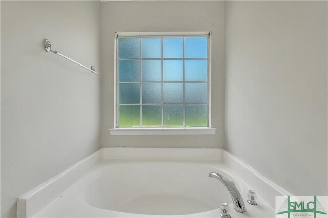 bathroom featuring a tub to relax in