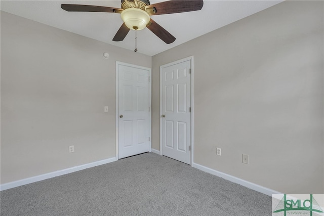 carpeted empty room with ceiling fan