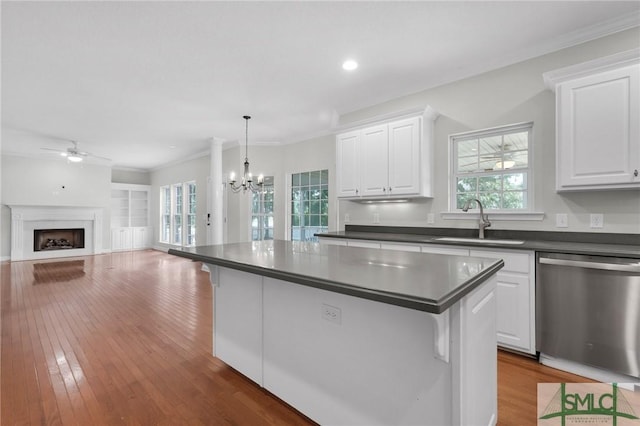 kitchen with white cabinets, sink, and stainless steel dishwasher