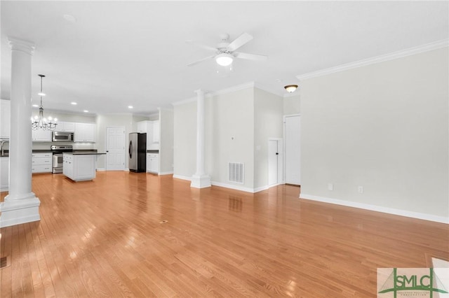 unfurnished living room with ceiling fan with notable chandelier, light hardwood / wood-style flooring, crown molding, and decorative columns