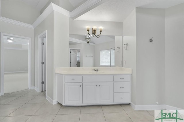 bathroom with vanity, crown molding, tile patterned flooring, and a notable chandelier