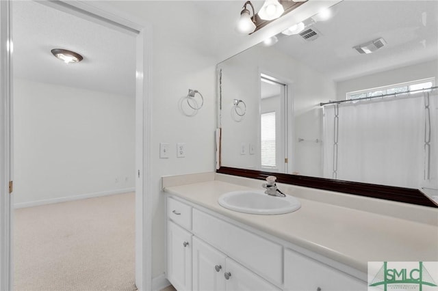 bathroom featuring vanity and a shower with shower curtain