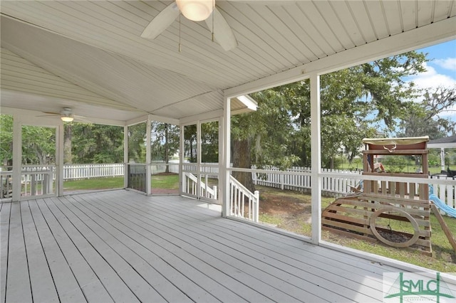 unfurnished sunroom featuring ceiling fan, plenty of natural light, and vaulted ceiling