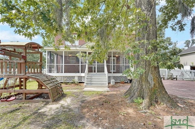 back of house with a sunroom